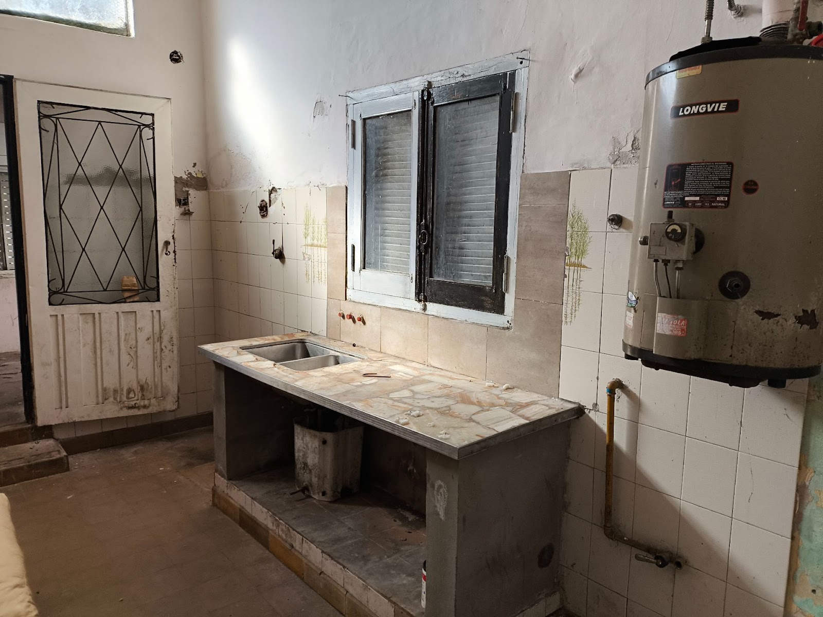 1 dormitorio · cocina · comedor · baño · living · patio con asador - foto 2